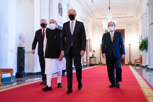 President Joe Biden walks with other world leaders