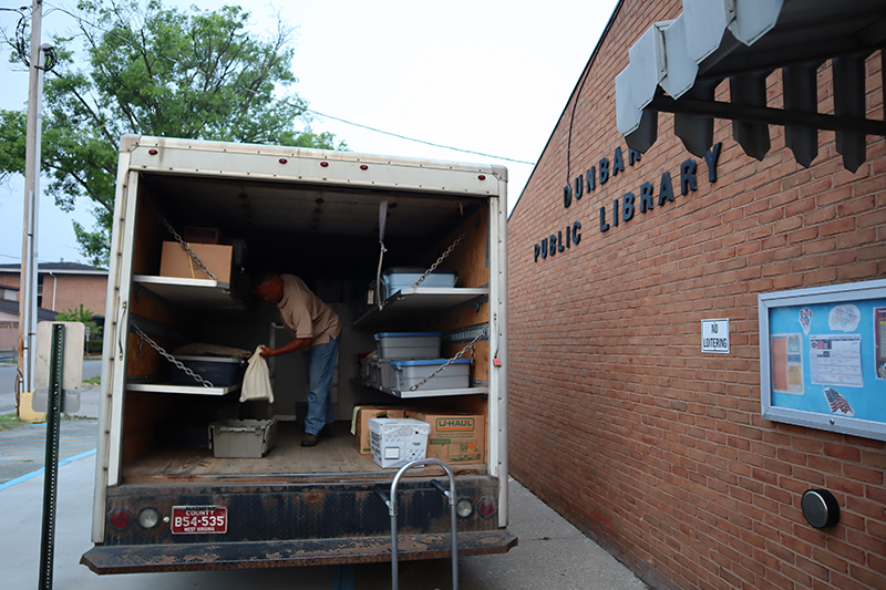 Gary sorting in the KCPL courier truck at Dunbar Branch