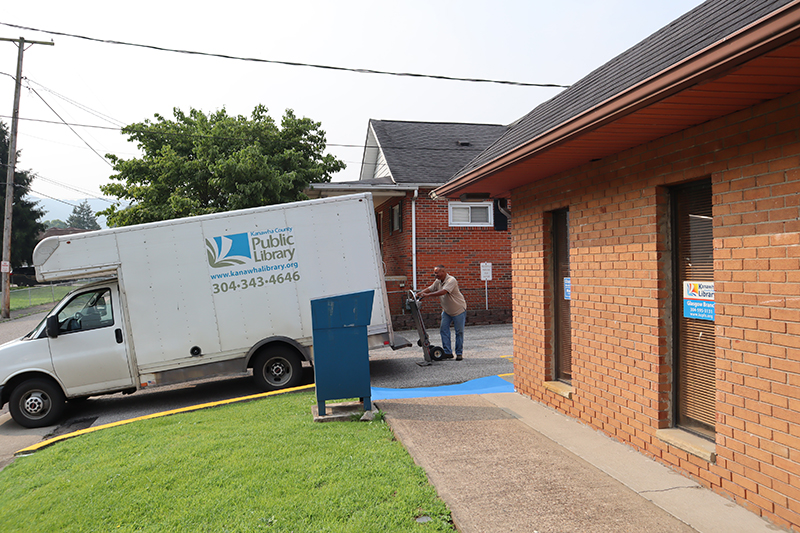 Gary loading up the cart into the courier truck outside Glasgow Branch