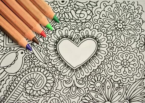 Blank coloring page with colored pencils