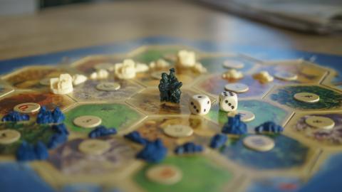a picture of a board game and playing pieces
