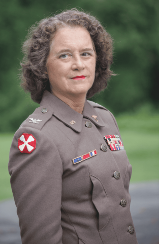 Col. Ruby Bradley photo, woman with curly hair standing in uniform outdoors
