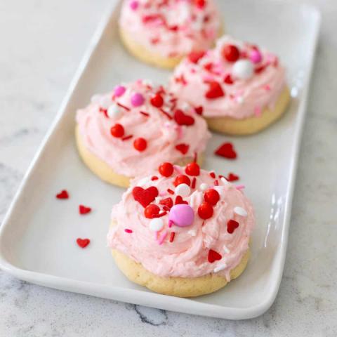 Cookies with pink icing and red sprinkles