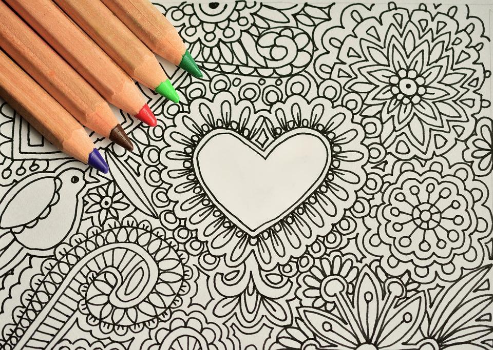 Blank coloring page with colored pencils