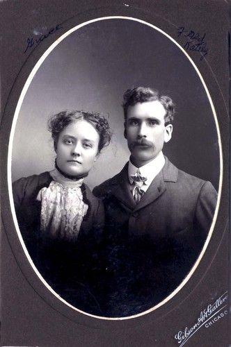 antique black & white portrait of a woman and a man in an oval card fram