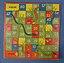 an old snakes and ladders game board