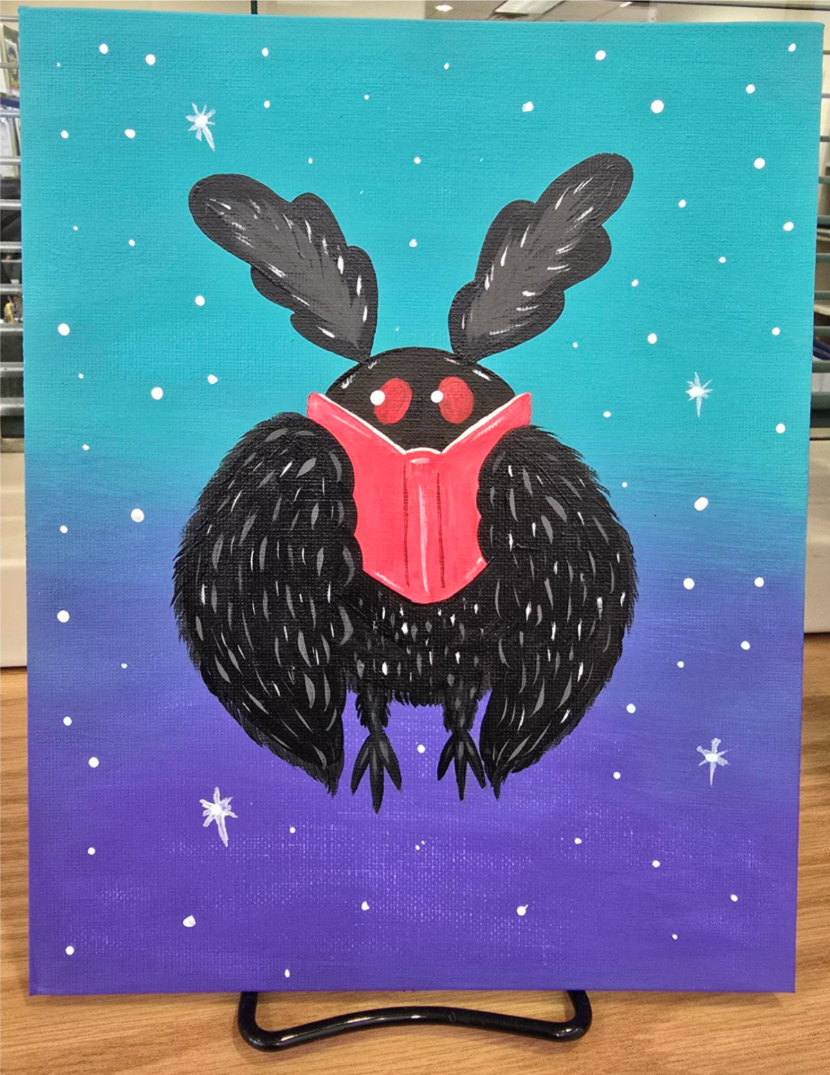 Mothman is feeling bookish! 