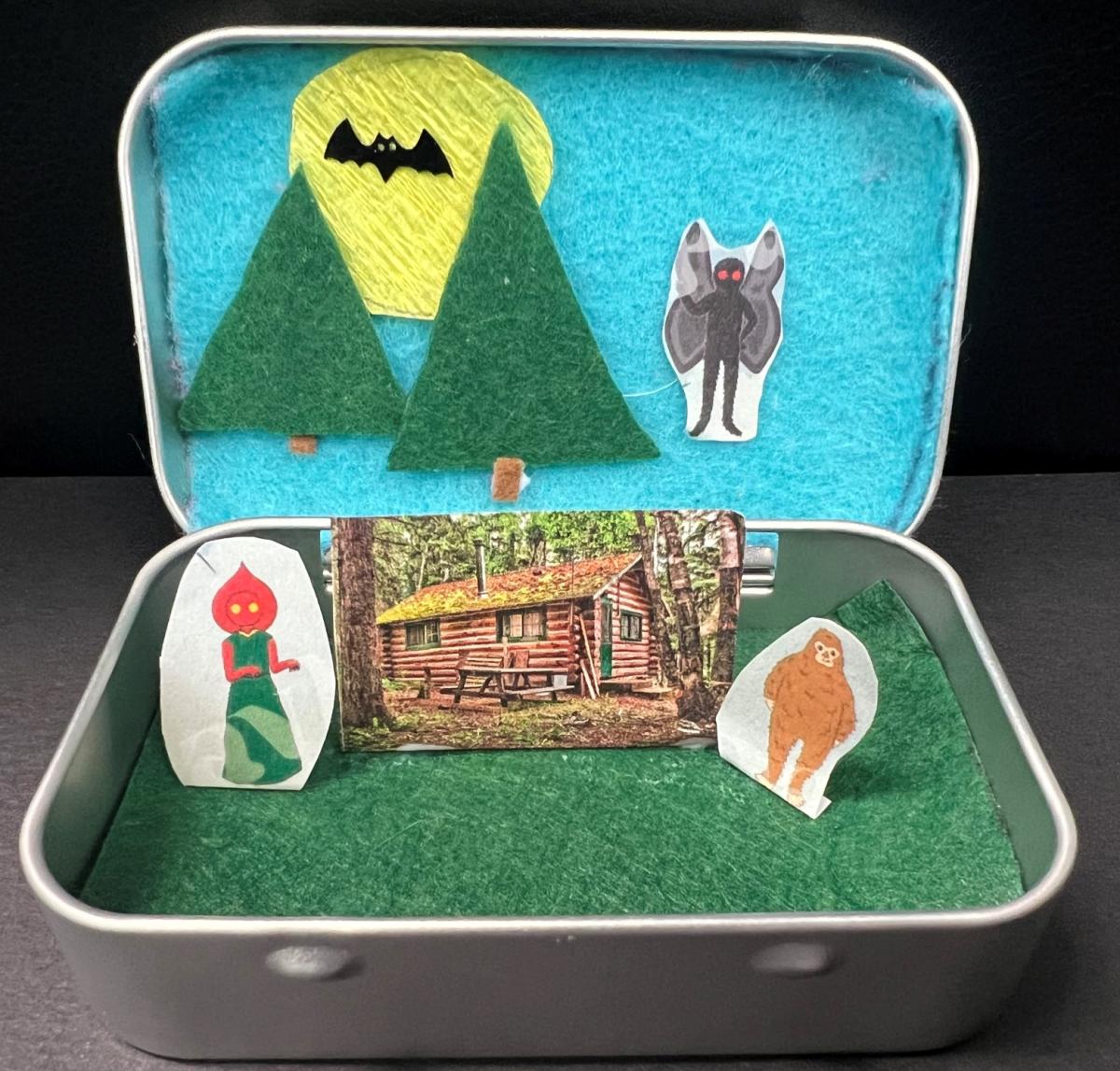 Tin box with cryptids scene inside