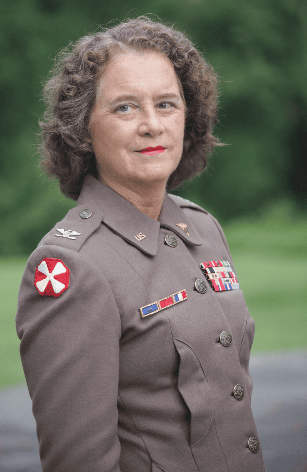 Col. Ruby Bradley photo, woman with curly hair standing in uniform outdoors