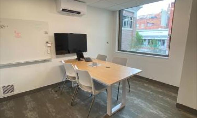 (Desk, wall PC, dry-erase board, and window of the Teen Study Room.)