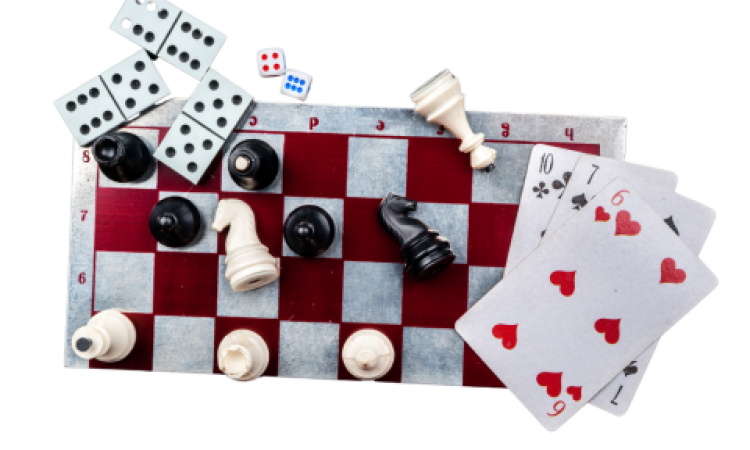 (Chess, playing cards, and dominoes to represent a small selection of our board game options.)